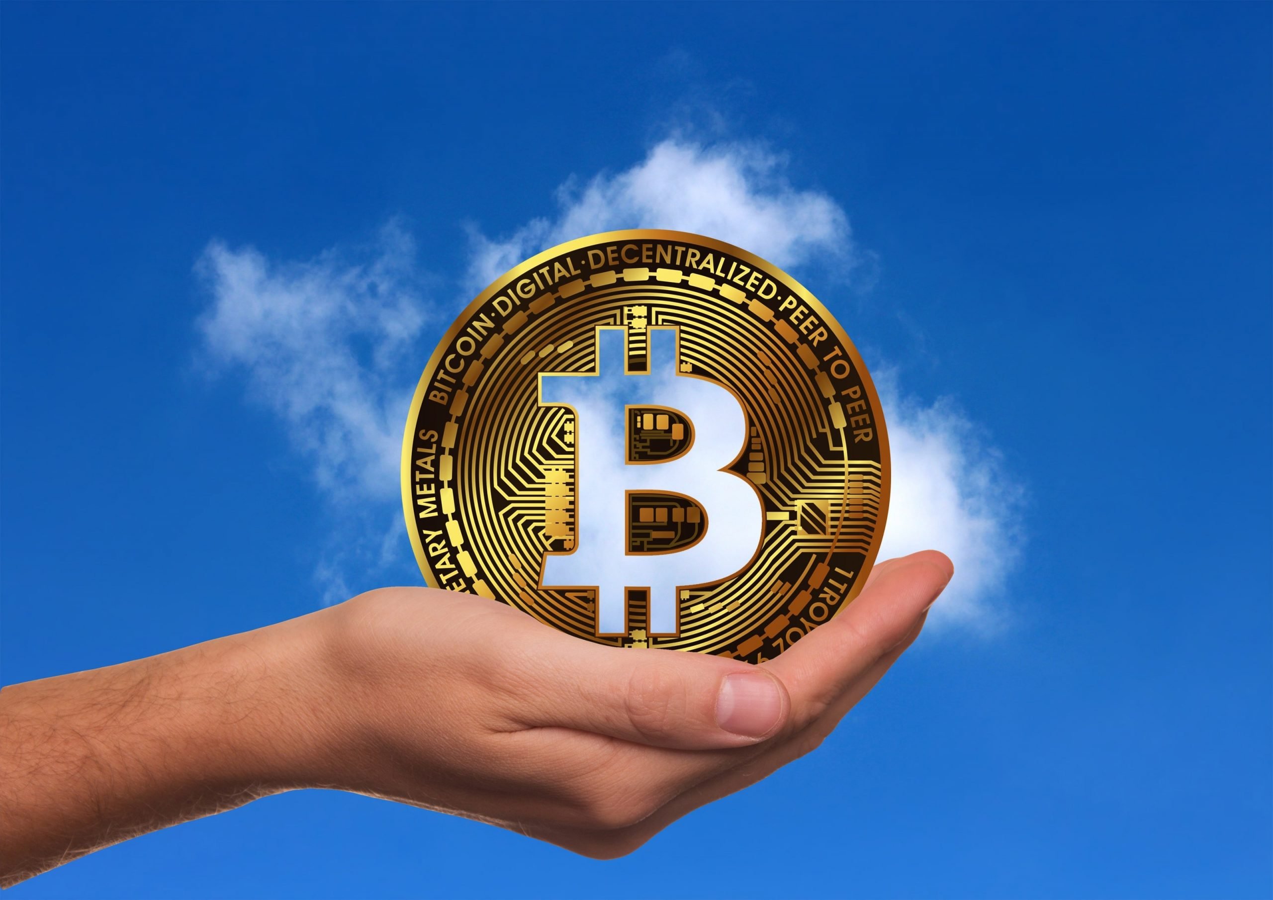 Image of Bitcoin against sky background. Green cryptocurrency may use solar energy to harness the energy required